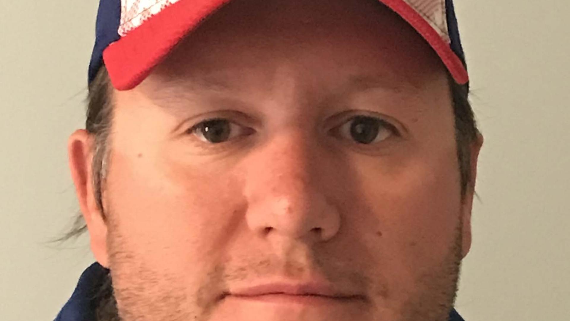 Headshot of Chris Gauthier. There is a man wearing a Toronto Blue Jays baseball cap.
